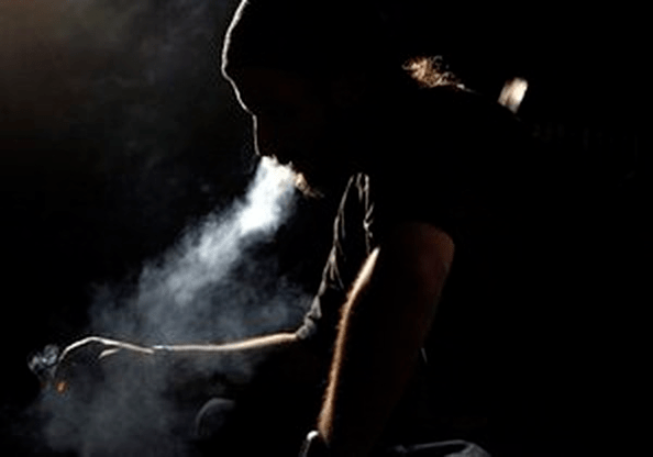 man smokes a cigarette