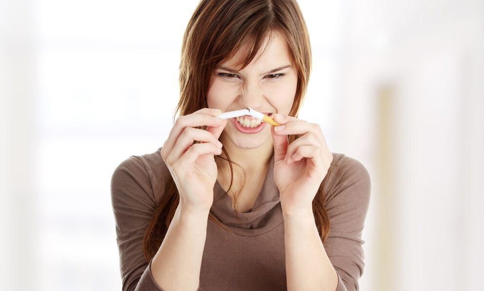 girl breaks a cigarette and stops smoking photo 1